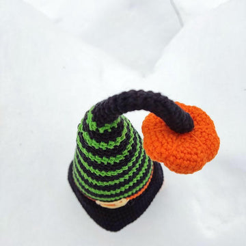 Halloween black gnome with pumpkin