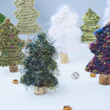 Many Christmas trees knitted flat