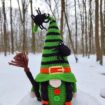 Halloween witch with a broom
