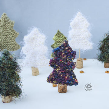 Many Christmas trees knitted flat