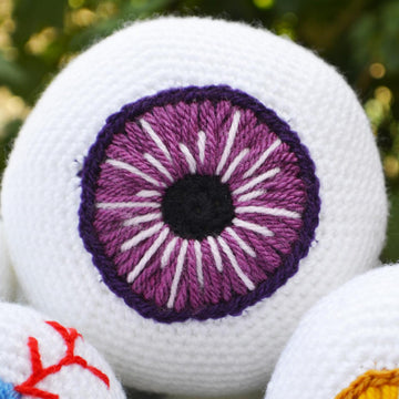 Crochet eyeballs. Creepy eyes. Halloween spooky eyes. Eyeball with blood vessels
