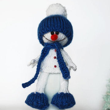 Lovely and sweet Snowman in the blue hat and scarf for keeping warm breakfast egg