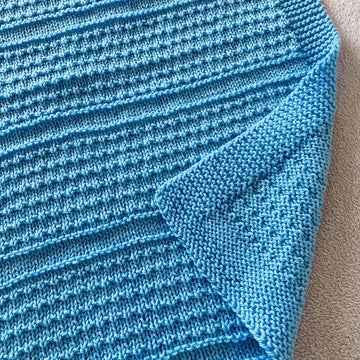 Idris Baby Blanket in Aran or DK