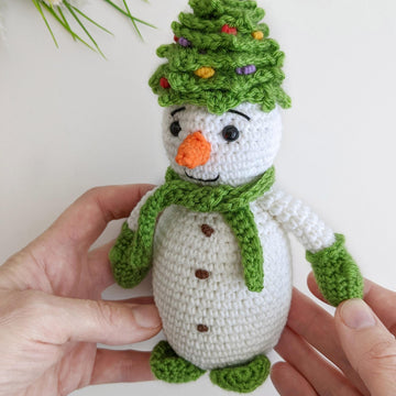 Crochet snowman in a Christmas tree hat amigurumi pattern