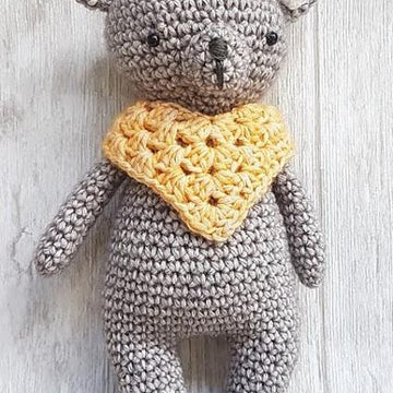 Bear with poncho and bow