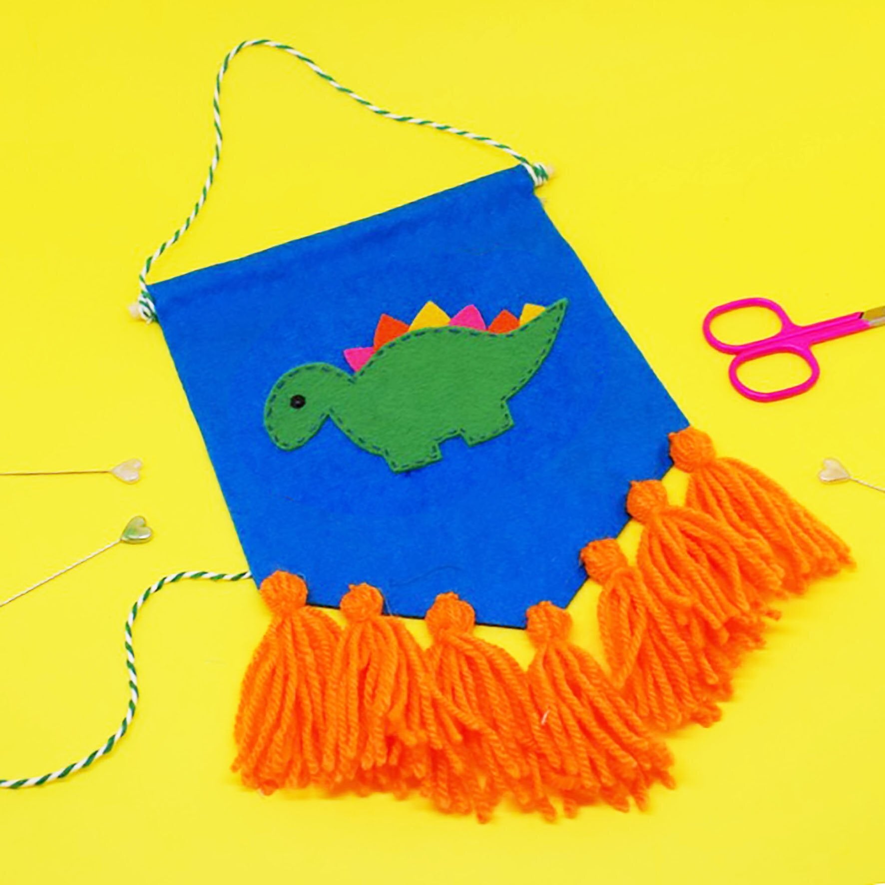 The Make Arcade Dino Tassel Banner - 15cm x 20cm