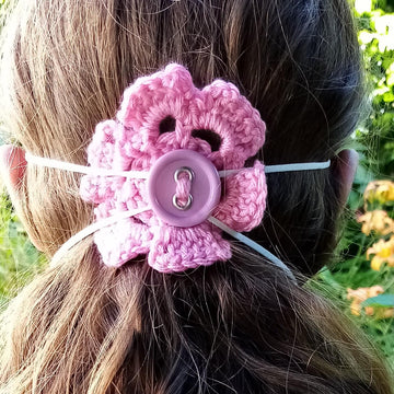 Crochet flower to hold facemask in place