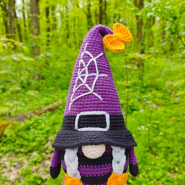 Halloween gnome (girl) with a broom