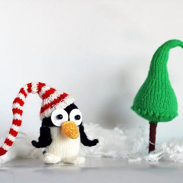 New Year Penguin in hat with Christmas tree