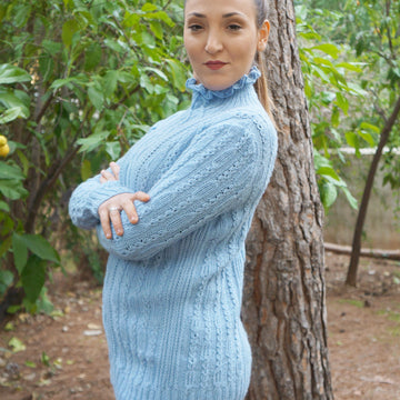 Ruffled neck cabled sweater