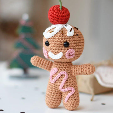 Amigurumi gingerbread with a cherry on top