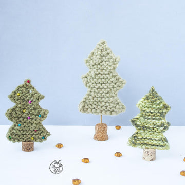 Many Christmas trees knitted flat