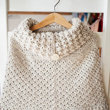 Poncho with oversized collar
