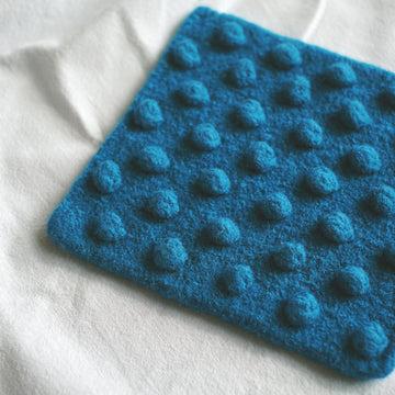 Bobble - Felted Pot Holder in MillaMia Naturally Soft Aran