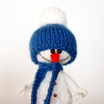 Lovely and sweet Snowman in the blue hat and scarf for keeping warm breakfast egg
