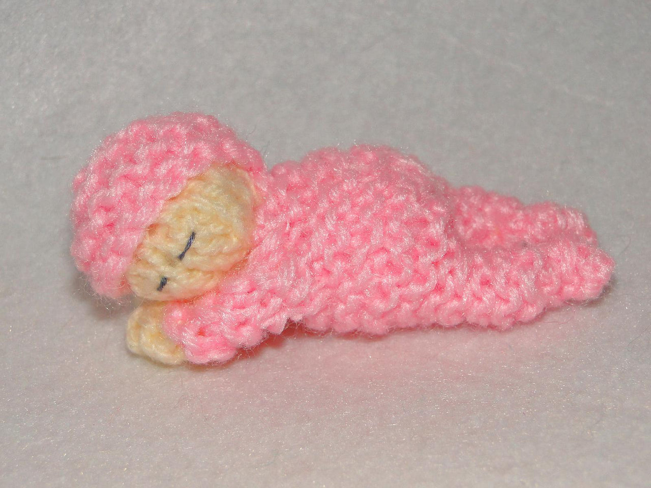 Lovely sleeping baby knitting pattern