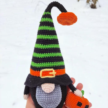 Halloween black gnome with pumpkin