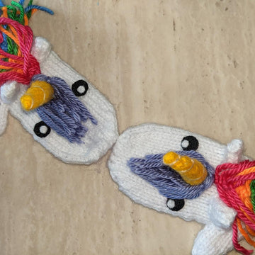 Knit rainbow unicorn mittens