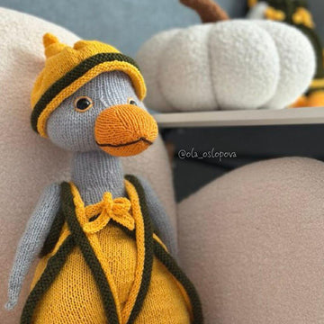 Knitting toy clothes for goose