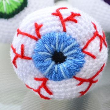 Crochet eyeballs. Creepy eyes. Halloween spooky eyes. Eyeball with blood vessels