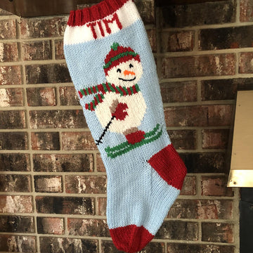 Snowman stocking on skis