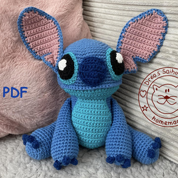 Blue alien amigurumi doll