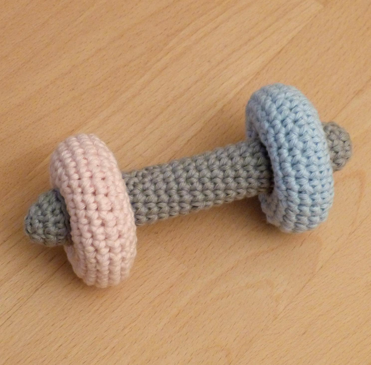 Dumbbell rattle