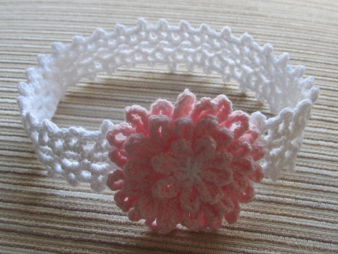 White Lacy Crochet Headband with a Pink Flower