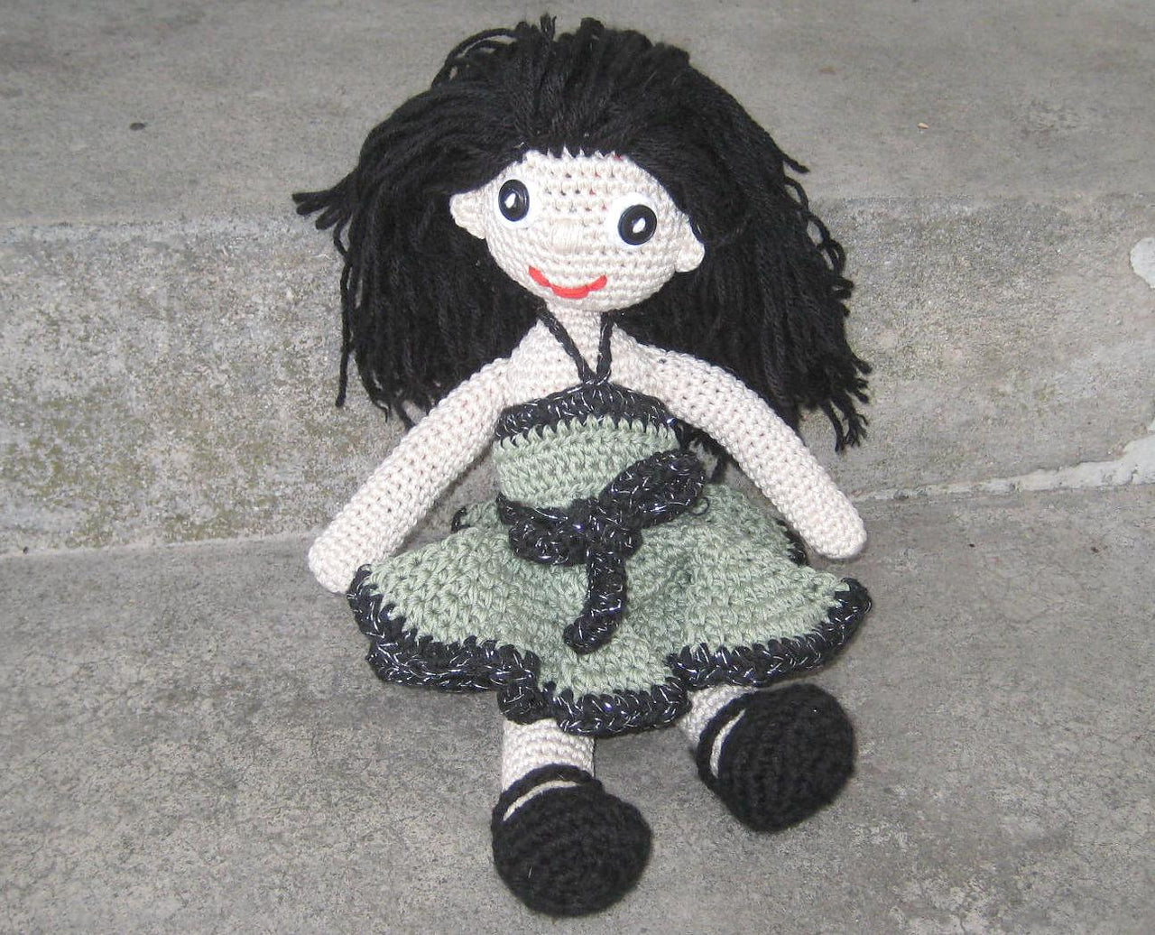 Crochet doll in olive green dress