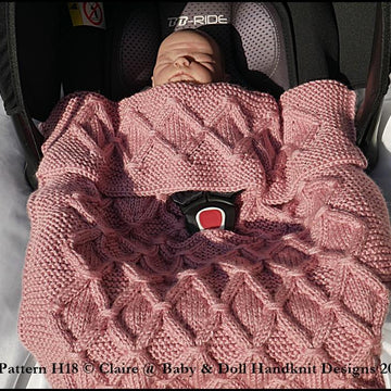 Cabled check blanket to fit car seat, pram or pushchair
