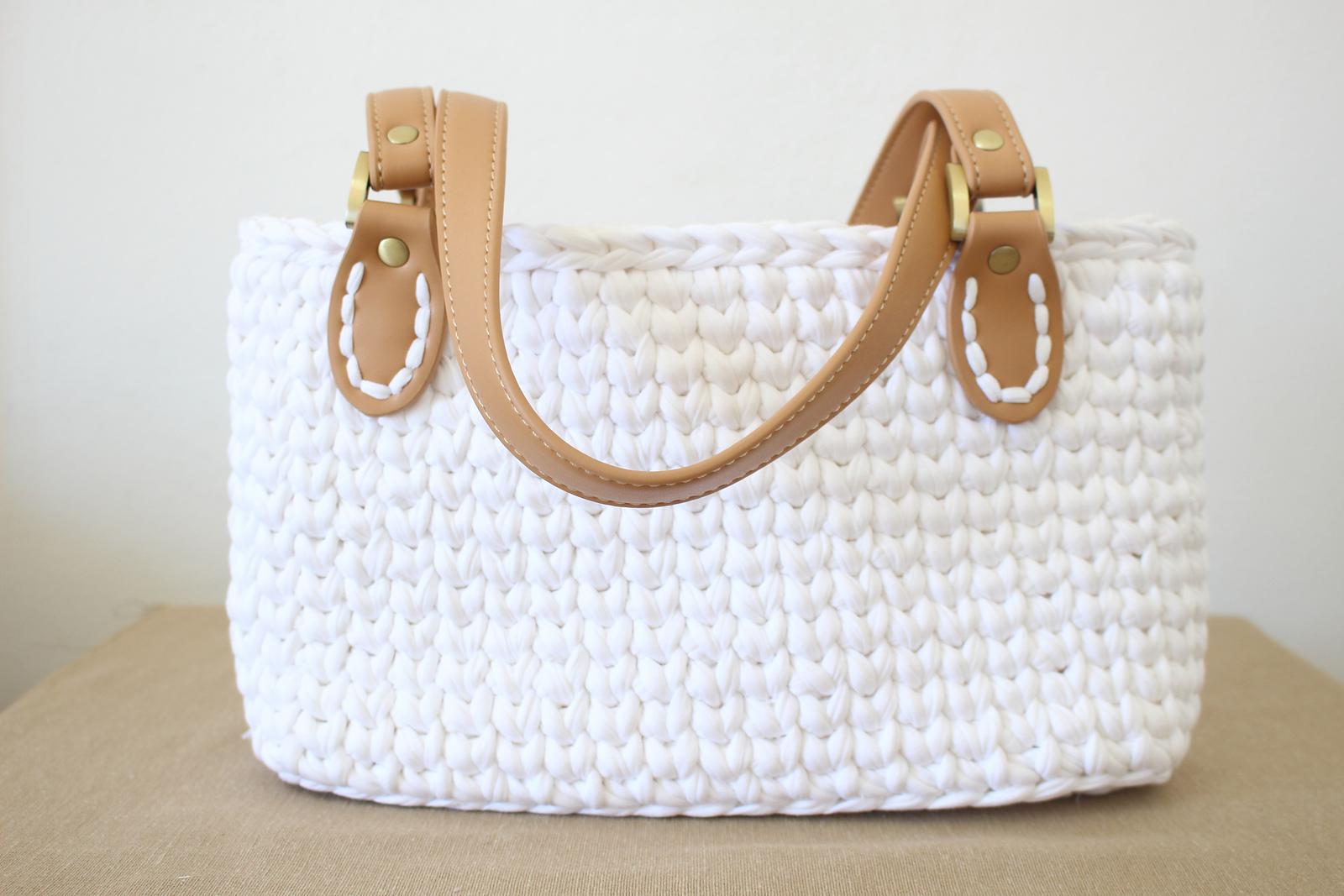 Handbag with leather straps