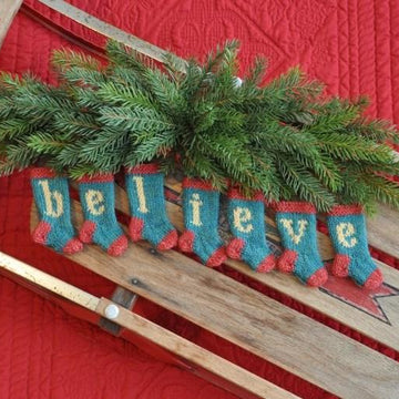 BELIEVE Set of 7 Christmas Stocking Ornaments