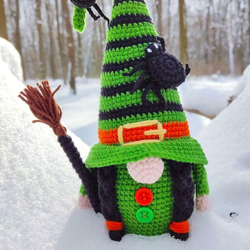 Halloween witch with a broom