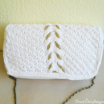 White knit clutch with gold tassel
