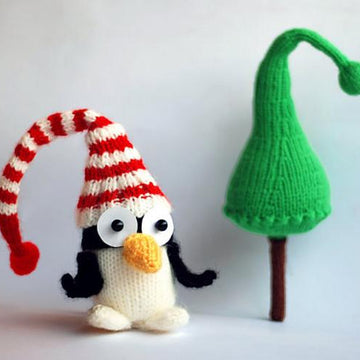 New Year Penguin in hat with Christmas tree