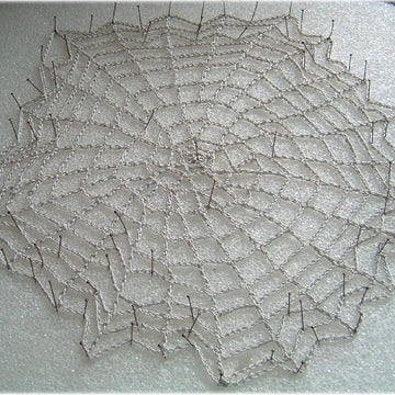 Spider's web doily and bowl