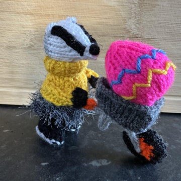 EASTER BADGER PUSHING WHEELBARROW & EGG