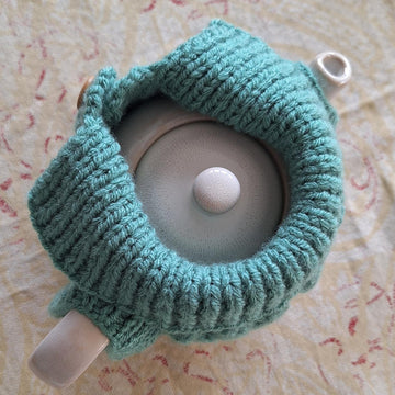 Aran jacket tea cosy