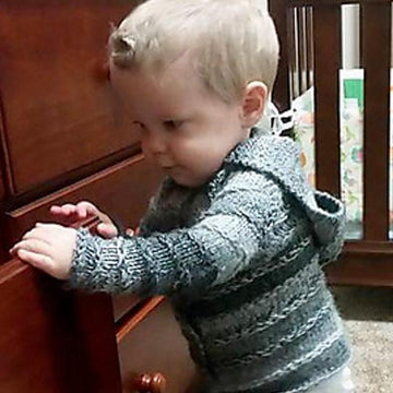 Enveloping baby cardigan