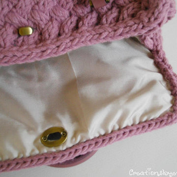 Textured bag knitted with woven pattern