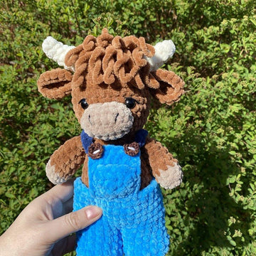 Highland cow with overalls