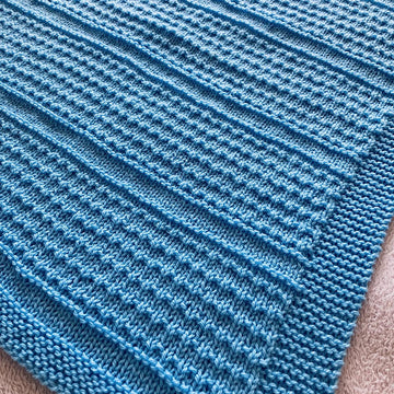 Idris Baby Blanket in Aran or DK