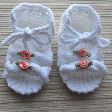 Knitted Sandals with Cables for a Baby Girl