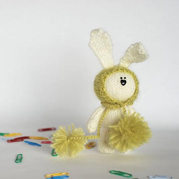 White rabbit in a light green hat