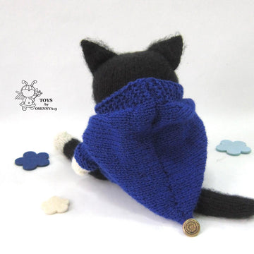 A cat is in an overcoat