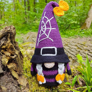 Halloween gnome (girl) with a broom