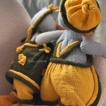 Knitting toy clothes for goose