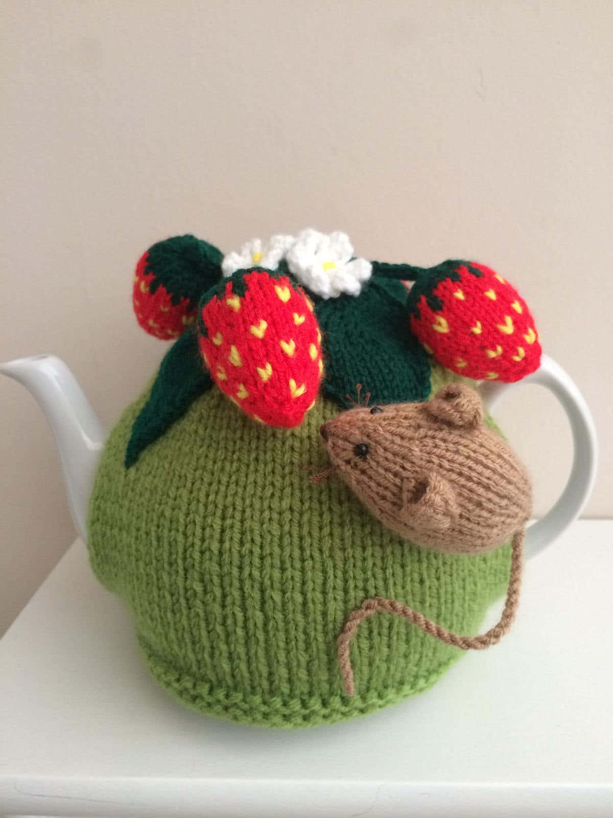 Nature tea cosy. Animal tea cosy .Pesky mouse in the strawberry patch