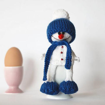 Lovely and sweet Snowman in the blue hat and scarf for keeping warm breakfast egg