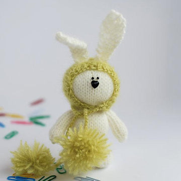 White rabbit in a light green hat